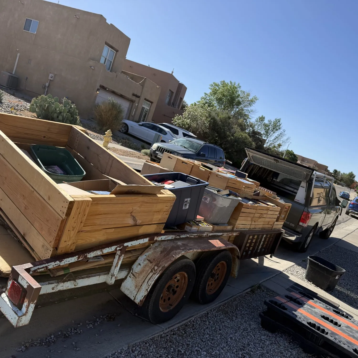 A trailer loaded with crates and totes of books from an Albuquerque estate library cleanout