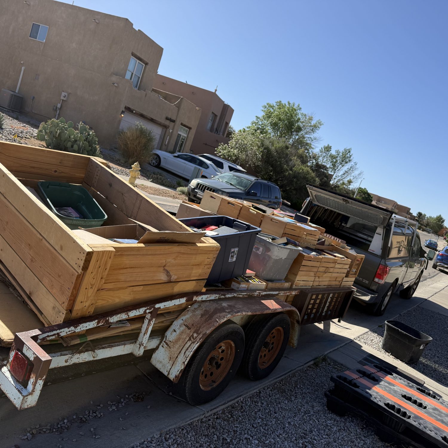 A trailer loaded with crates and totes of books from an Albuquerque estate library cleanout
