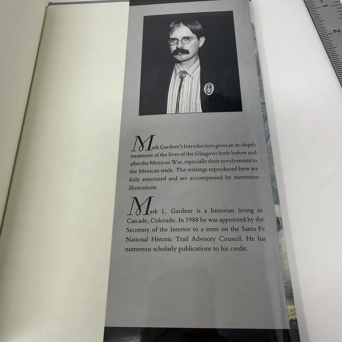Back dust jacket flap with author photograph of Mark L. Gardner in glasses and bolo tie, plus biographical text describing him as a Cascade Colorado historian appointed to the Santa Fe National Historic Trail Advisory Council in 1988