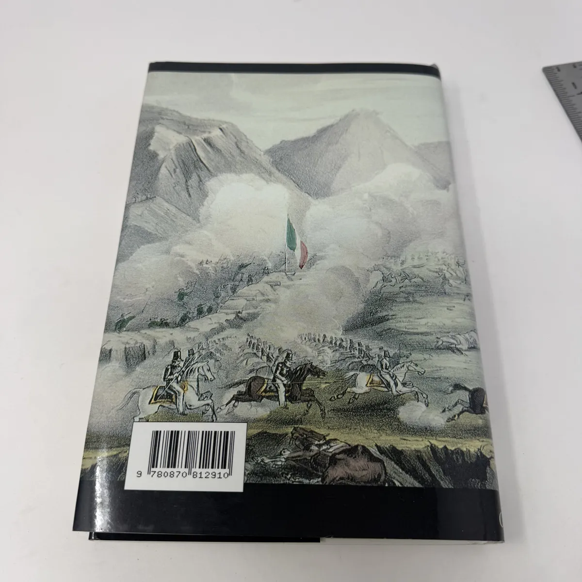 Back of dust jacket with full color lithograph of an Mexican-American War-era battle scene with mountains in background, troops attacking in formation, ISBN barcode 9780870812910
