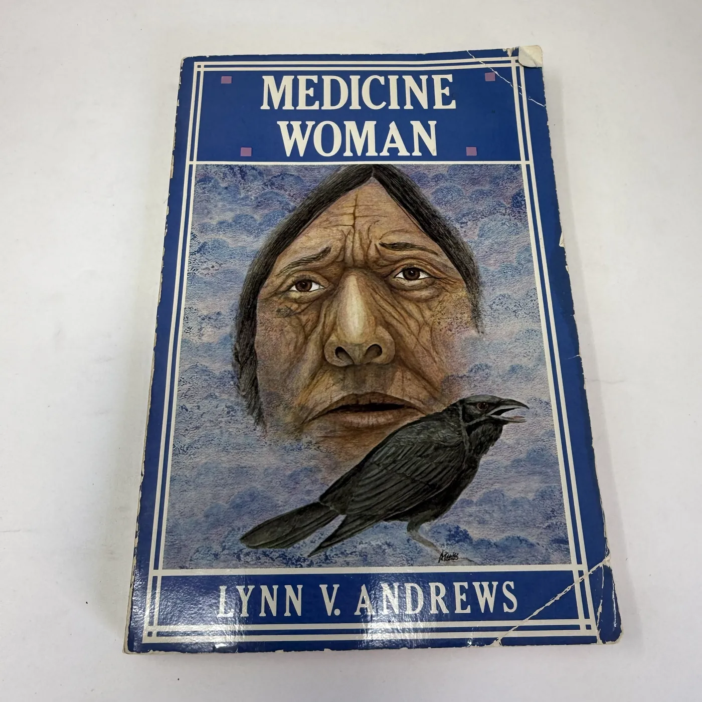 Blue cover of Lynn V. Andrews Medicine Woman Harper and Row 1983 first paperback with elderly Indigenous woman portrait and perched crow illustration by Dan Reeves