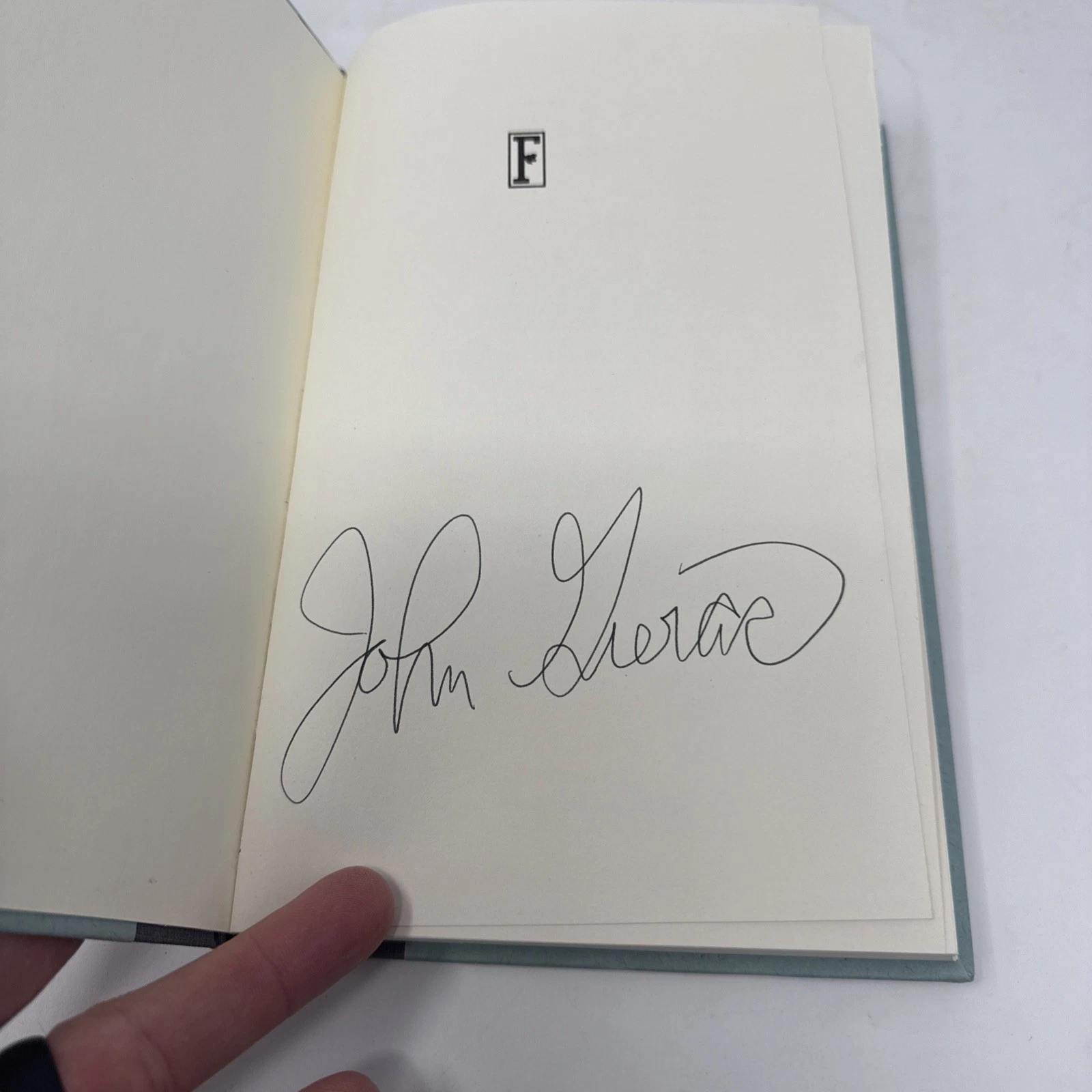 The flyleaf with John Gierach's signature in bold black ink