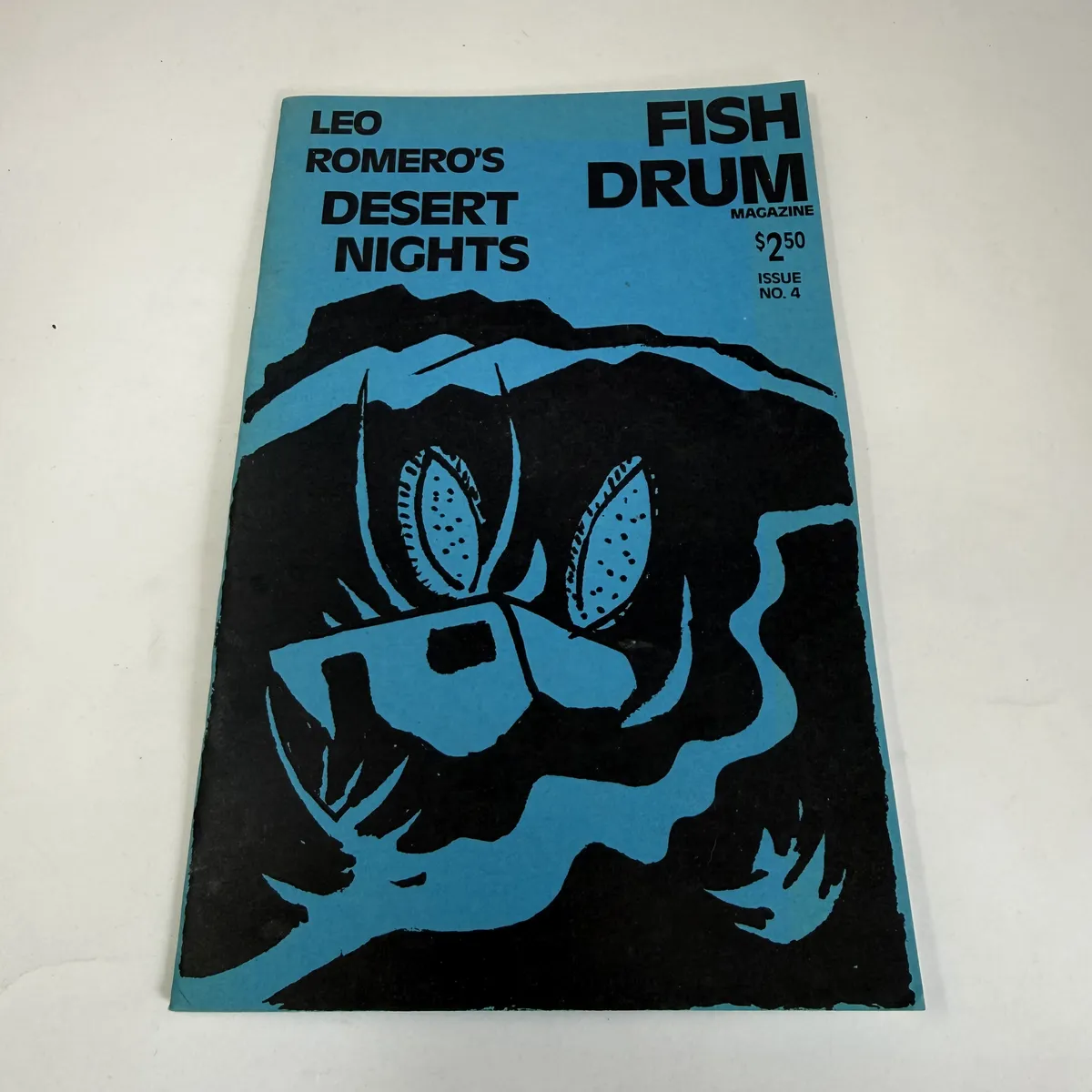 Cover of Fish Drum Magazine Issue 4 with turquoise and black design featuring Leo Romero's Desert Nights, Santa Fe small press 1989