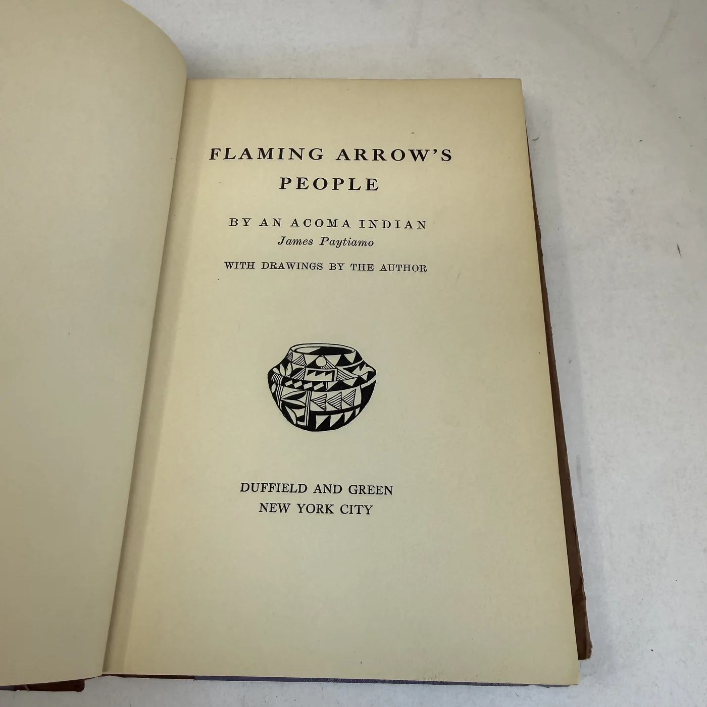 Title page of Flaming Arrow's People, By An Acoma Indian, James Paytiamo, with drawings by the author, Duffield and Green New York City, photographed at New Mexico Literacy Project