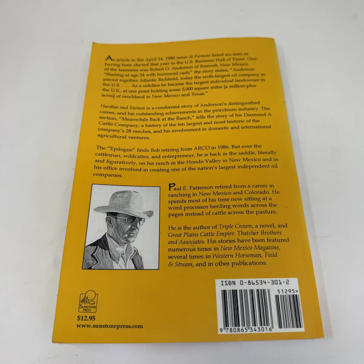 Back cover of Hardhat and Stetson with publisher's blurb describing Anderson's 1986 induction to the U.S. Business Hall of Fame, the company's 28-ranch Diamond A history, and the 1986 ARCO retirement, with author bio of Paul E. Patterson and ISBN 0-86534-301-2