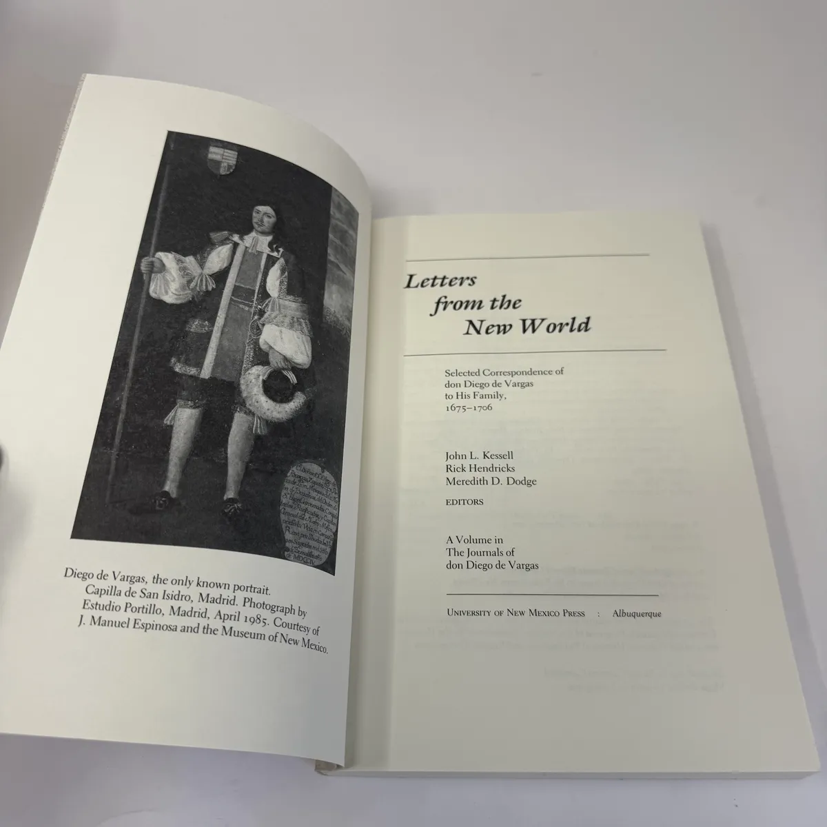 Title page facing the only known portrait of Diego de Vargas, an oil painting from the Capilla de San Isidro in Madrid showing Vargas in 17th-century Spanish formal dress with curled hair, lace cuffs, and ornamented sash; caption notes the photograph was taken by Estudio Portillo Madrid in April 1985 courtesy of J. Manuel Espinosa and the Museum of New Mexico