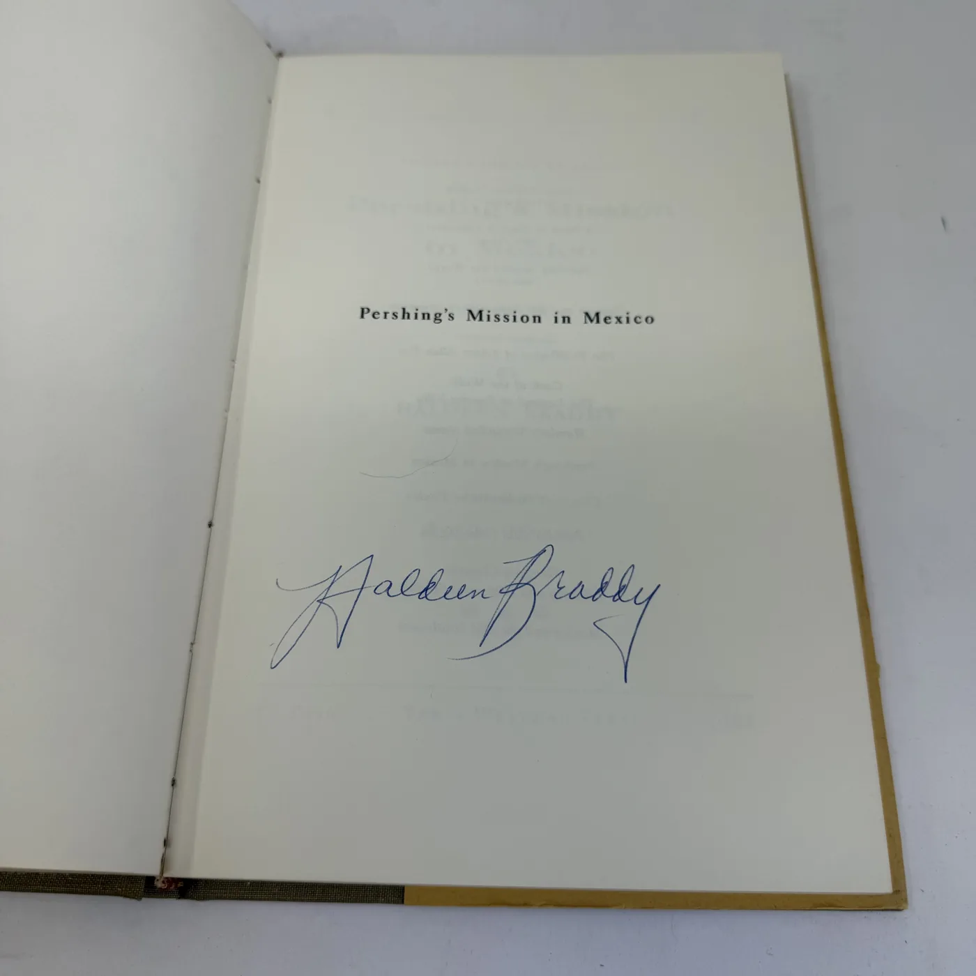 The half-title page of Pershing's Mission in Mexico signed in blue ballpoint by Haldeen Braddy in a large flourishing signature, with 'Pershing's Mission in Mexico' set in serif type above the signature.