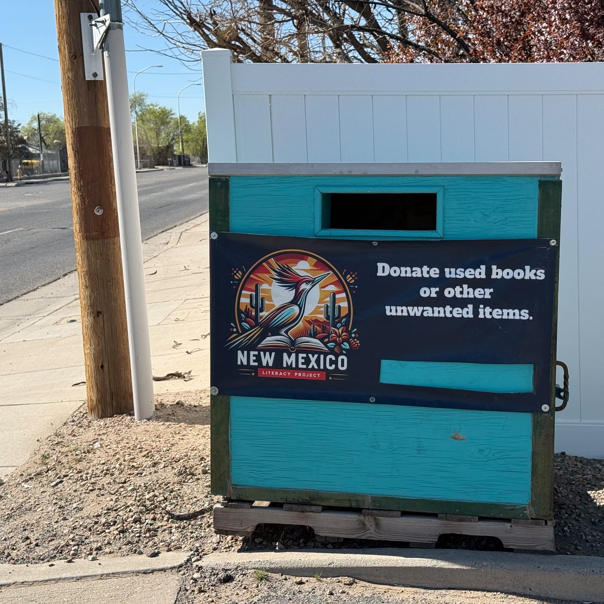 The NMLP outdoor 24/7 book and media donation drop box at 5445 Edith Blvd NE, Unit A in Albuquerque.