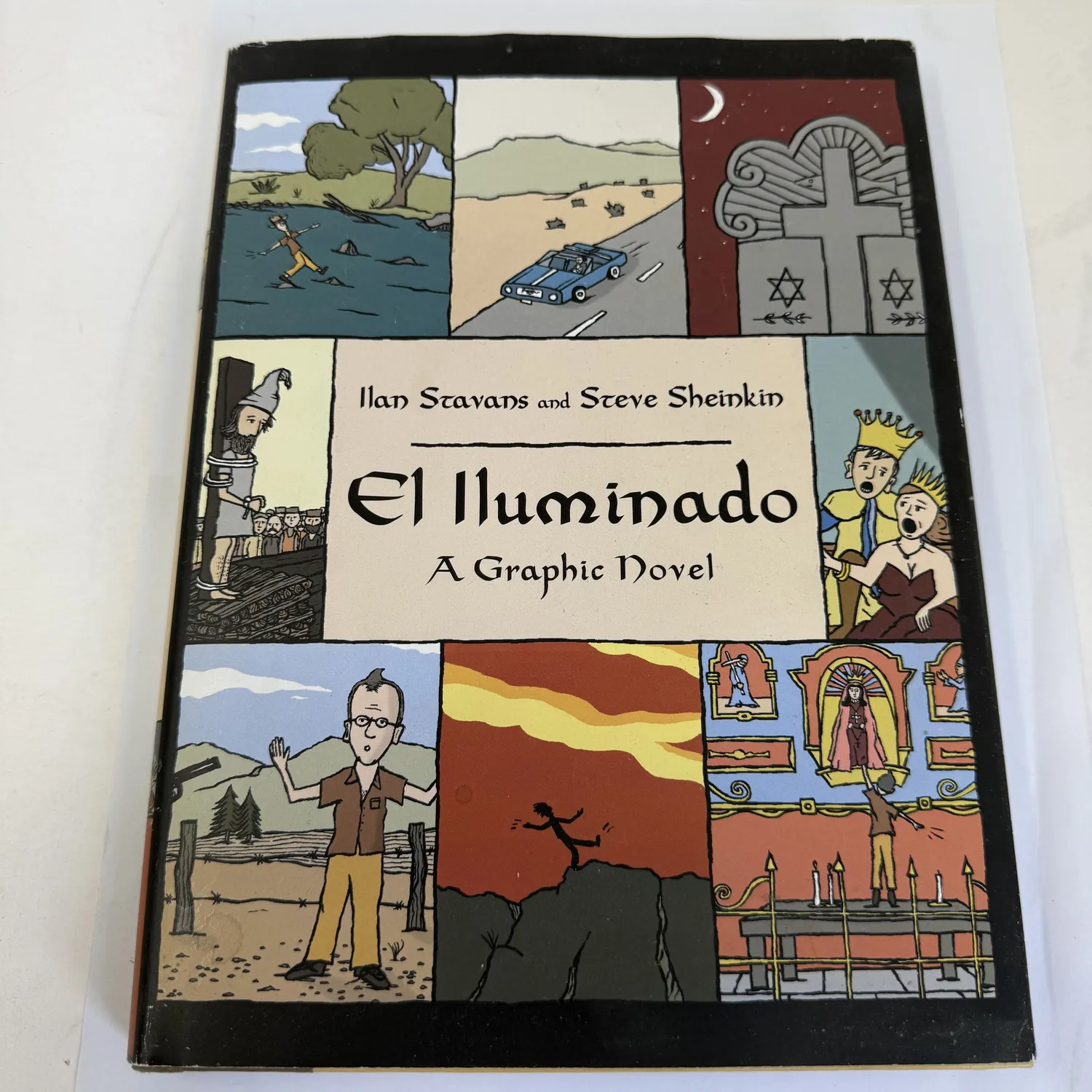 Front cover of El Iluminado: A Graphic Novel by Ilan Stavans and Steve Sheinkin — comic panel collage showing crypto-Jewish New Mexico scenes including desert landscapes, Star of David gravestone, church interiors, and Inquisition imagery, published by Basic Books