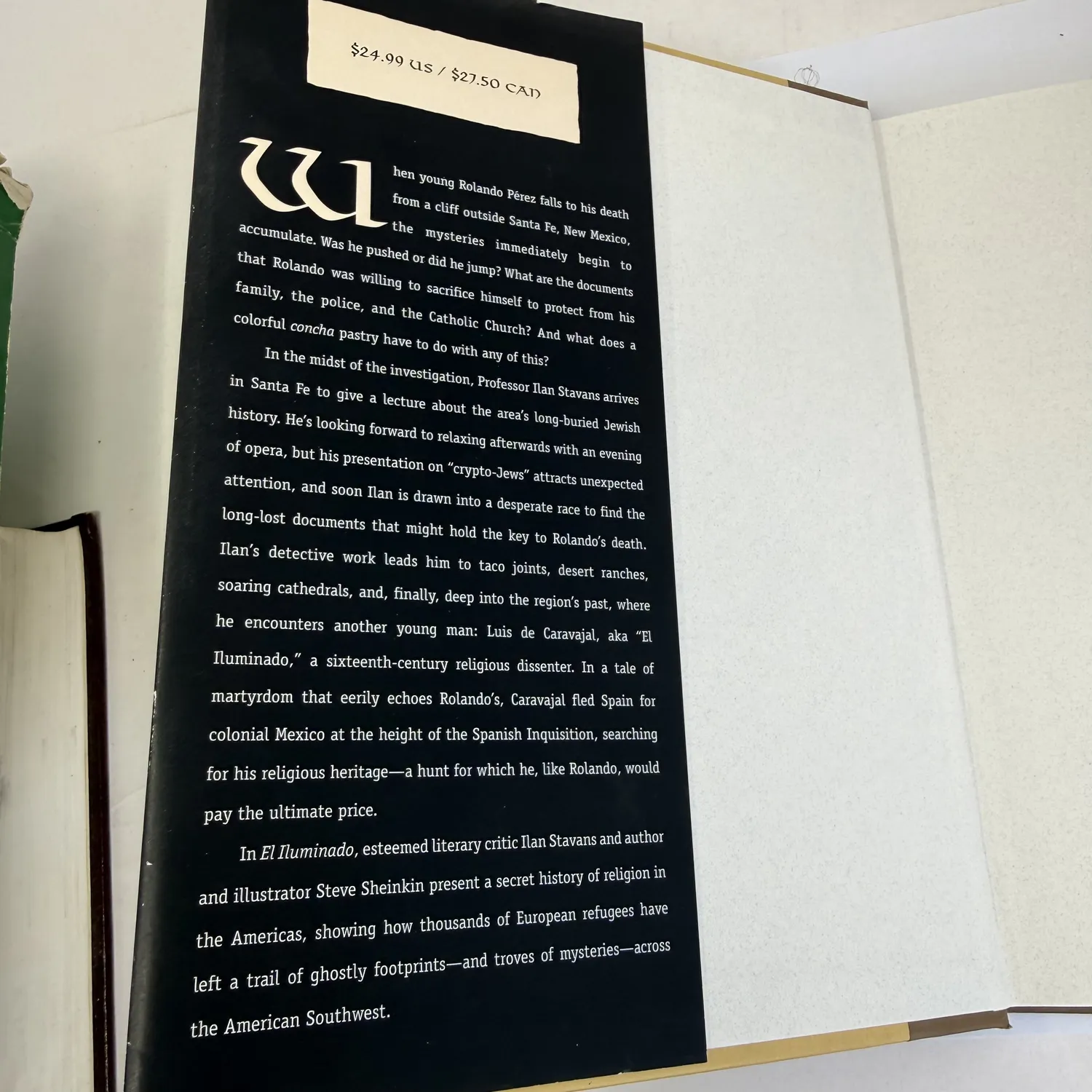 Inner dust jacket flap of El Iluminado — plot synopsis describing Rolando Pérez falling from a cliff outside Santa Fe, Professor Stavans lecturing on crypto-Jewish history, and the parallel sixteenth-century narrative of Luis de Caravajal fleeing the Spanish Inquisition