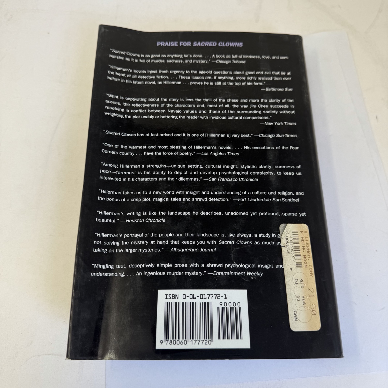 Back cover of Finding Moon by Tony Hillerman first edition showing Praise for Sacred Clowns review quotes from Chicago Tribune, New York Times, Los Angeles Times, and other major outlets, with ISBN barcode