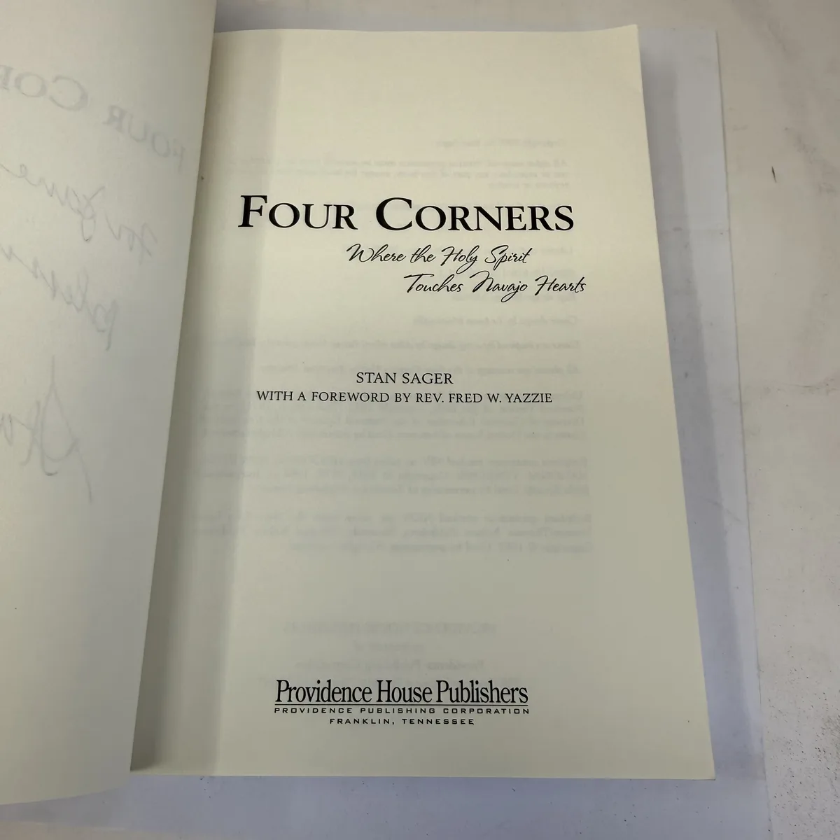 Title page of Four Corners Where the Holy Spirit Touches Navajo Hearts by Stan Sager with foreword by Rev. Fred W. Yazzie, Providence House Publishers Franklin Tennessee 2007, photographed at the New Mexico Literacy Project sorting desk