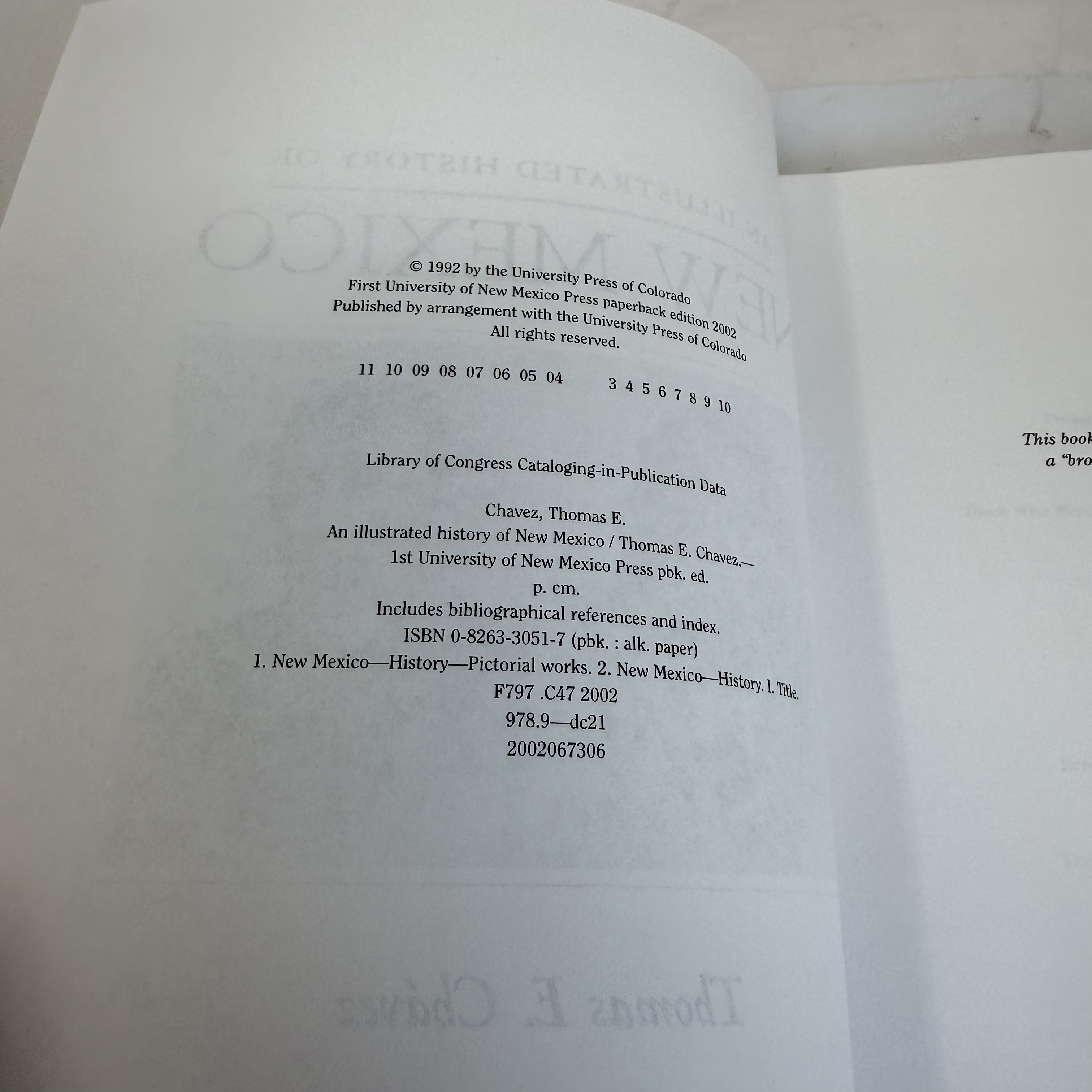 Copyright page of An Illustrated History of New Mexico — originally ©1992 University Press of Colorado, UNM Press paperback 2002, ISBN 0-8263-3051-7, Library of Congress F797 .C47 2002, Dewey 978.9, number line 11 10 09 08 07 06 05 04 — 3 4 5 6 7 8 9 10