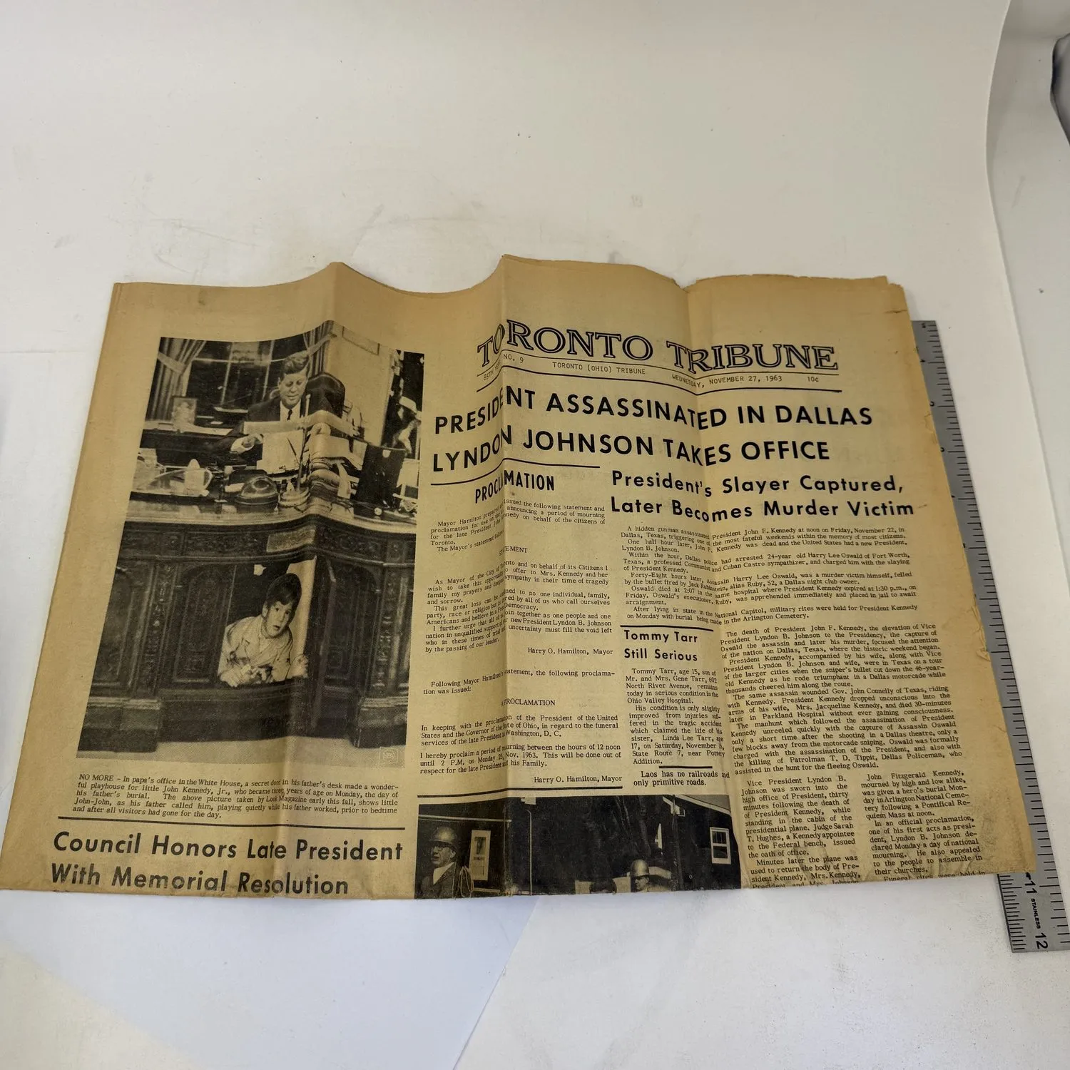 Front page of the Toronto Tribune, Toronto Ohio, Wednesday November 27 1963, with full-width headlines reading President Assassinated in Dallas, Lyndon Johnson Takes Office, and President's Slayer Captured Later Becomes Murder Victim. Mayor's proclamation and Council Honors Late President With Memorial Resolution visible below. Found in a New Mexico estate cleanout by the New Mexico Literacy Project.