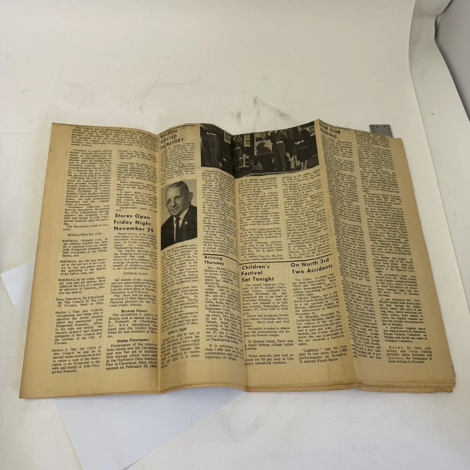 Inside pages of the Toronto Tribune from November 27 1963, showing additional JFK assassination coverage, photographs, local Toronto Ohio news, and small-town reporting alongside the national tragedy. Aged newsprint with fold marks.