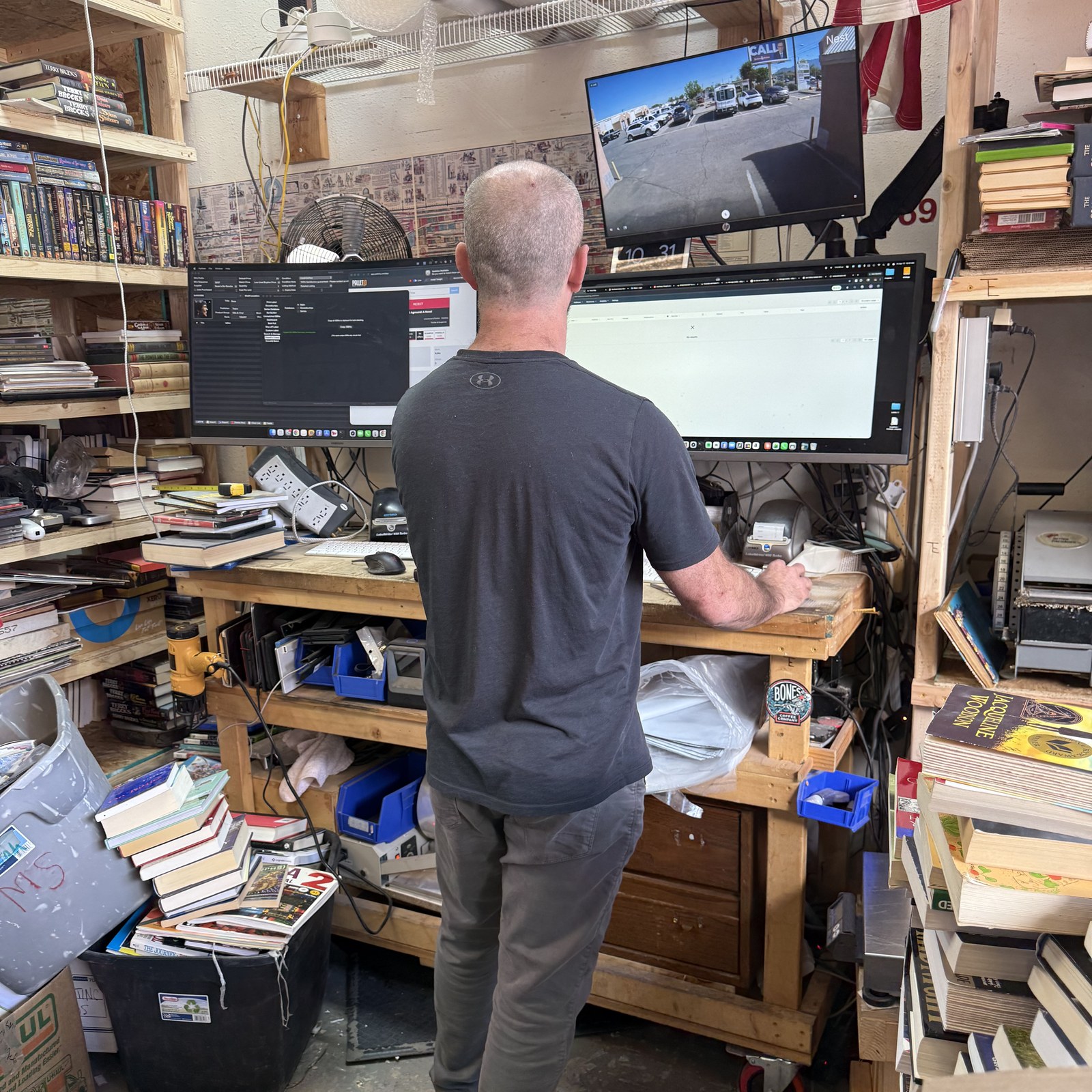 Josh Eldred hand-sorting donated books at the New Mexico Literacy Project workstation in Albuquerque