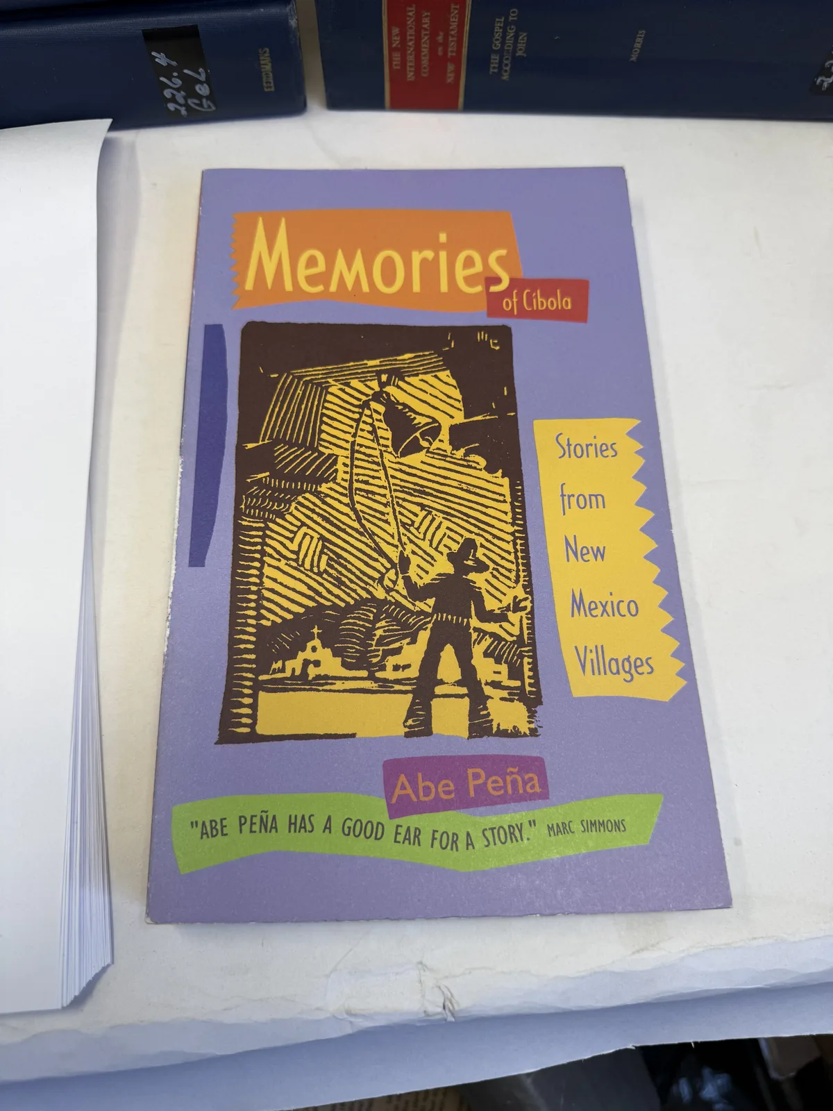 Cover of Memories of Cibola, stories from New Mexico villages, by Abe Pena, photographed at New Mexico Literacy Project