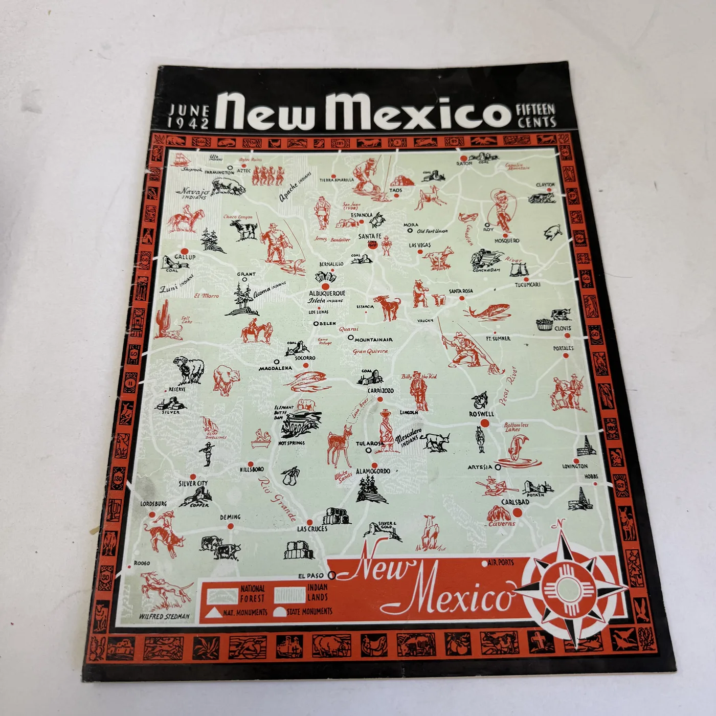 New Mexico Magazine June 1942 cover: Wilfred Stedman pictorial map of New Mexico with vignette border, signed in the plate at lower left — photographed at New Mexico Literacy Project