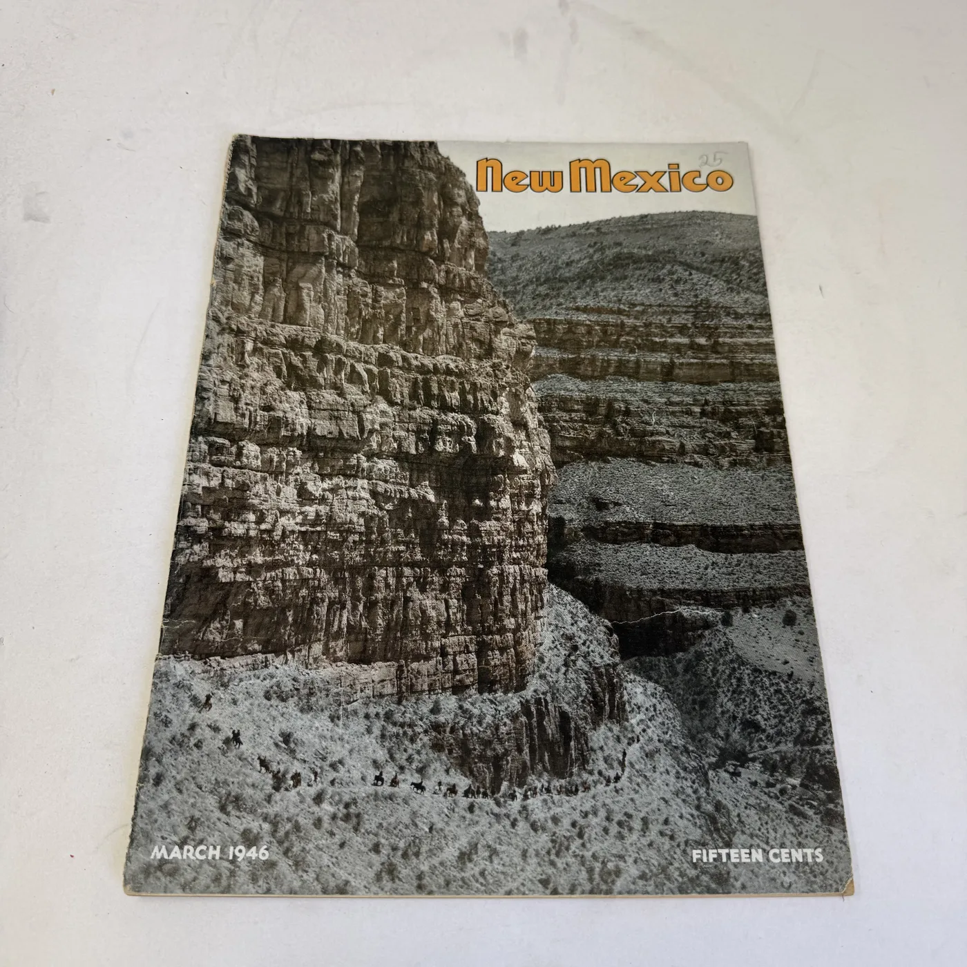 New Mexico Magazine March 1946 cover: sheer canyon cliffs, fifteen cents — photographed at New Mexico Literacy Project