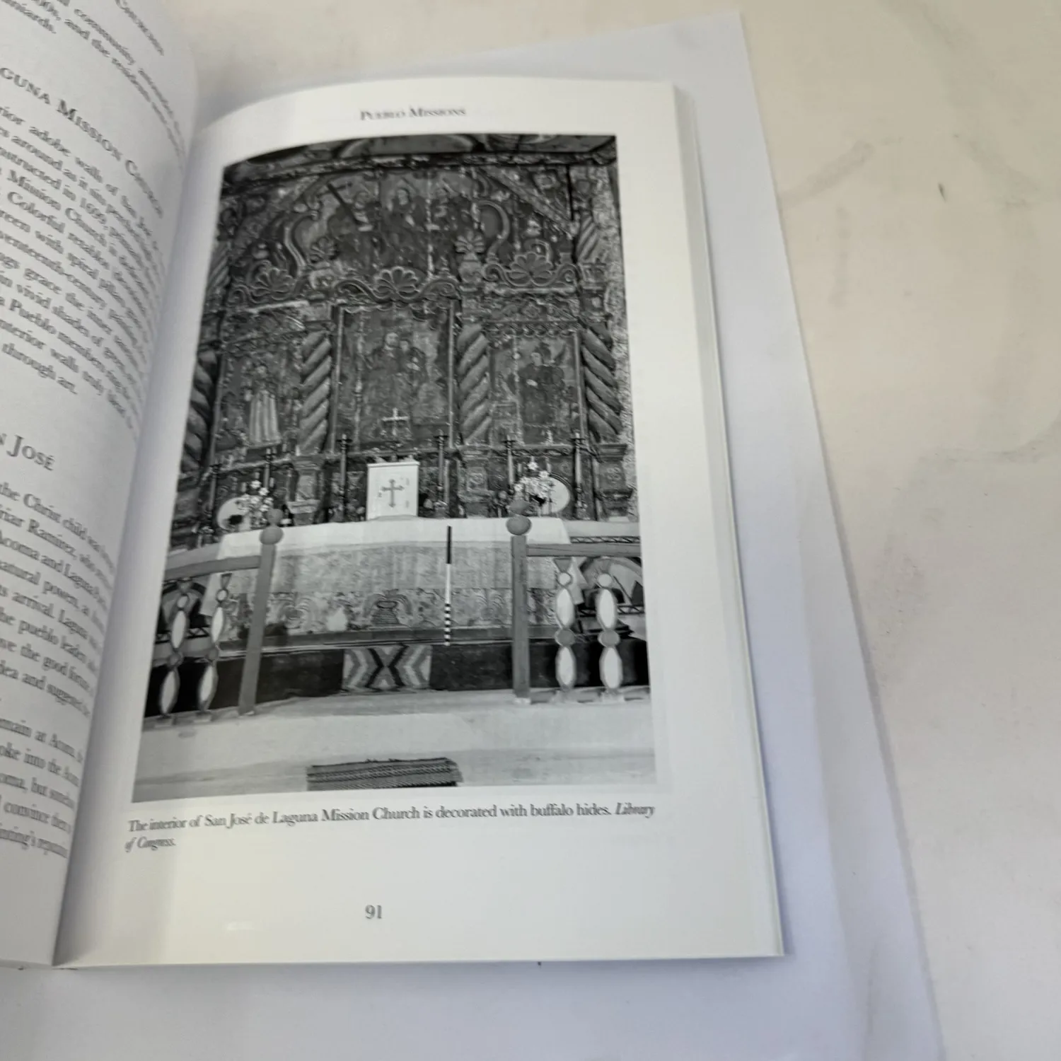 Interior page from New Mexico Mission Churches showing the San José de Laguna Mission Church reredos decorated with buffalo hides, Library of Congress photograph, chapter heading Pueblo Missions page 91