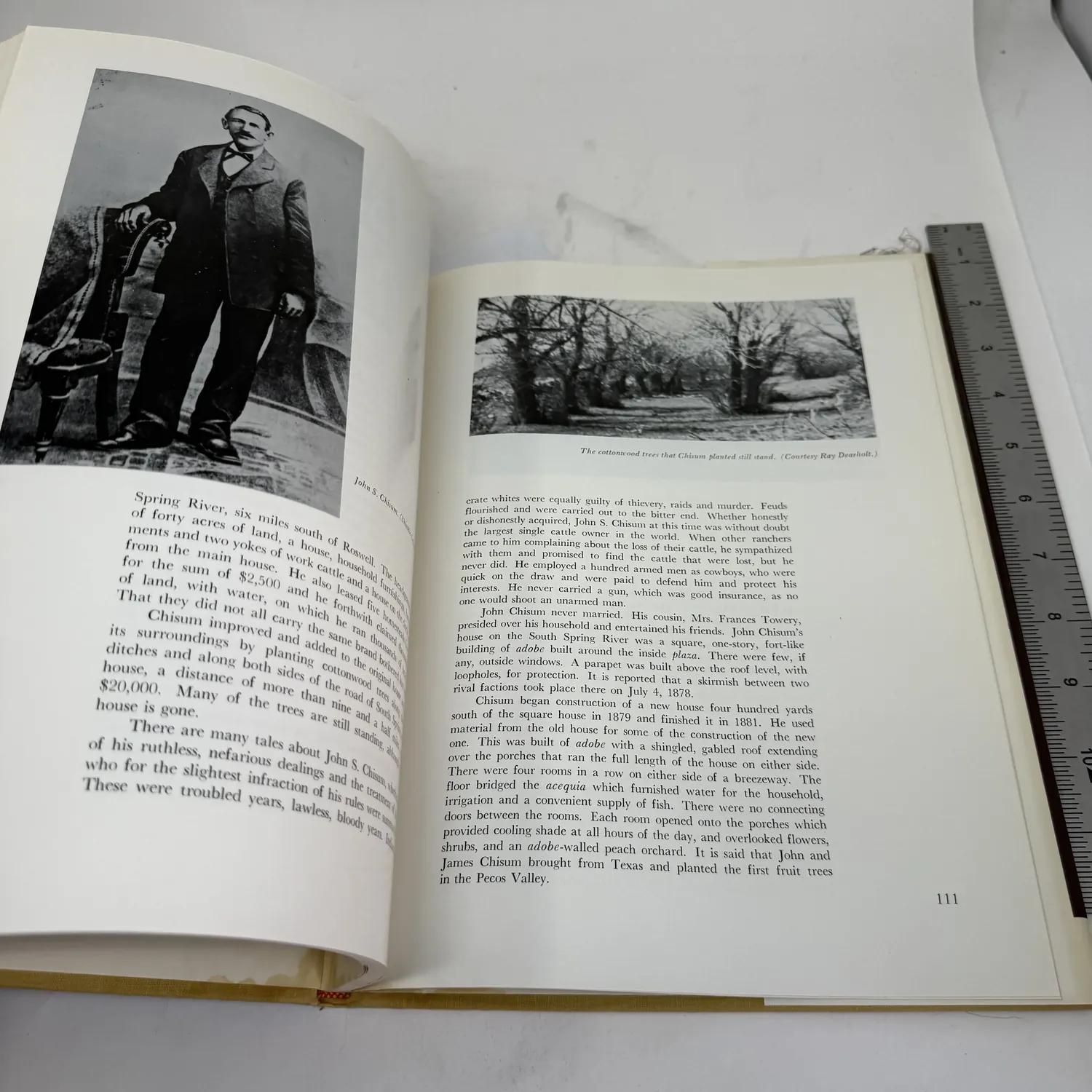 Interior spread page 111 of Old Houses of New Mexico — John Chisum ranch chapter showing nineteenth-century portrait of cattle baron John Chisum and landscape photo of cottonwood trees he planted along Spring River near Roswell, photo credit Roy Roseberry