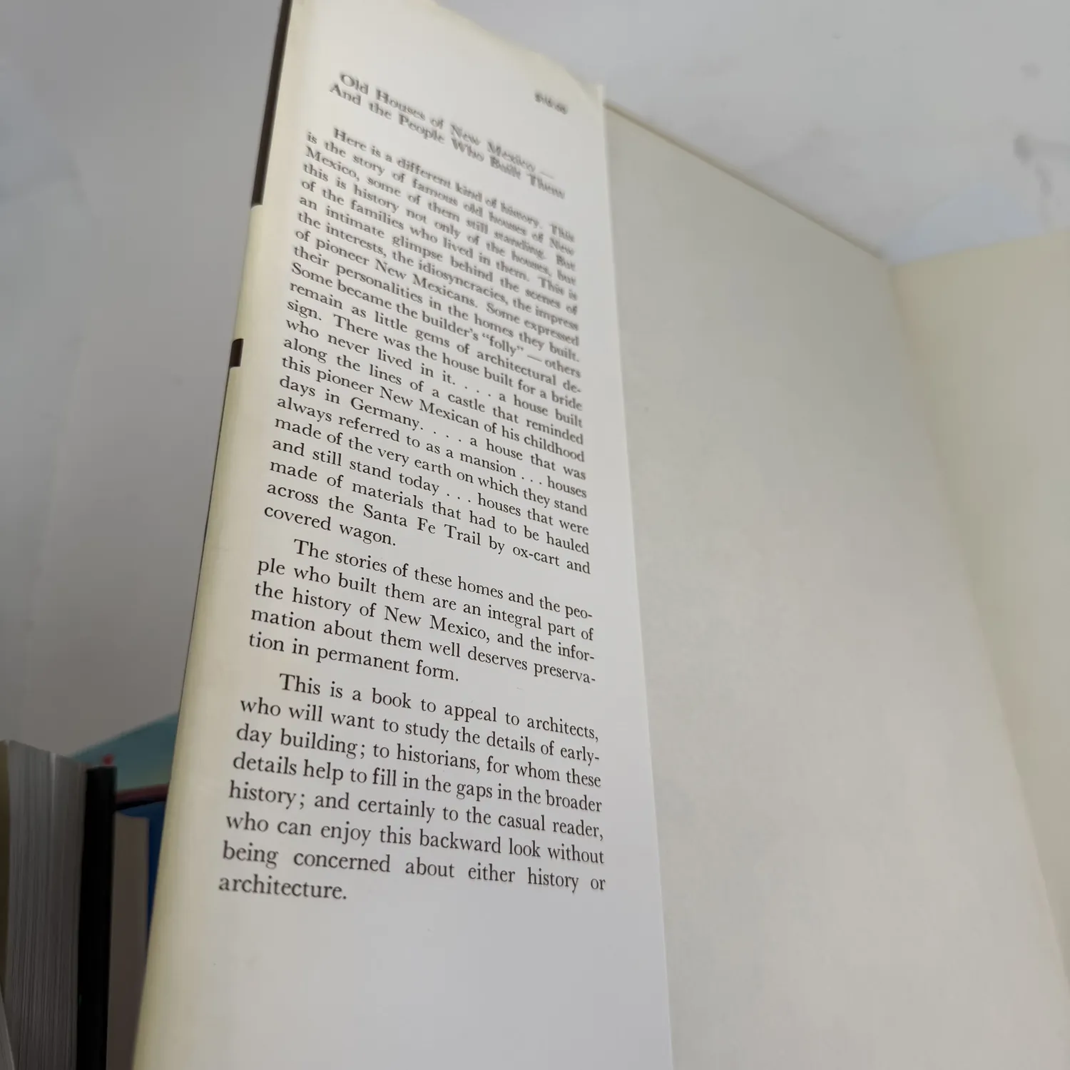 Dust jacket flap text of Old Houses of New Mexico and the People Who Built Them by Sytha Motto describing the book's coverage of territorial-era and pioneer homes across New Mexico