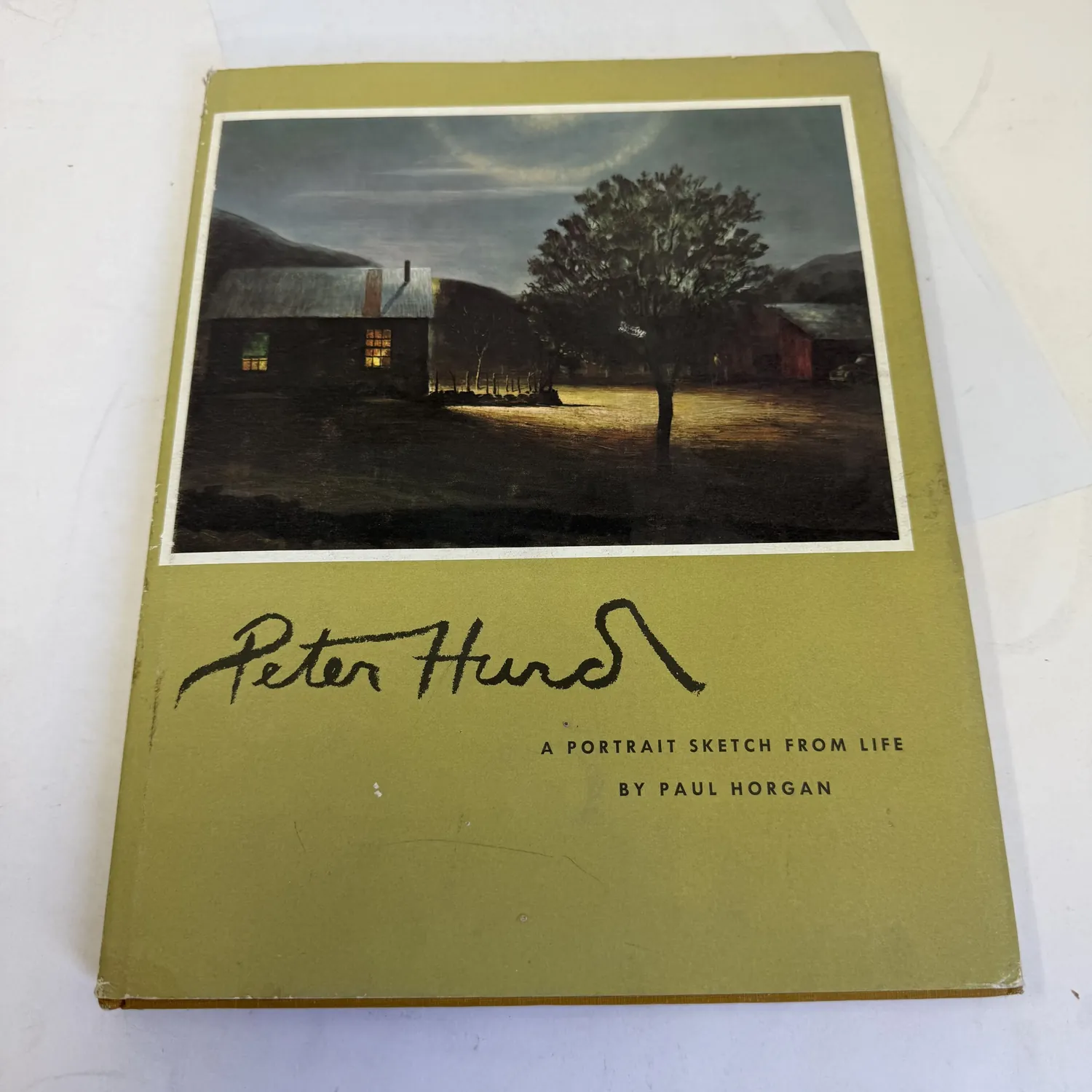 Front cover of Peter Hurd: A Portrait Sketch from Life by Paul Horgan — gold and olive cloth binding with Peter Hurd nighttime ranch painting, Hurd signature facsimile, published for Amon Carter Museum by University of Texas Press