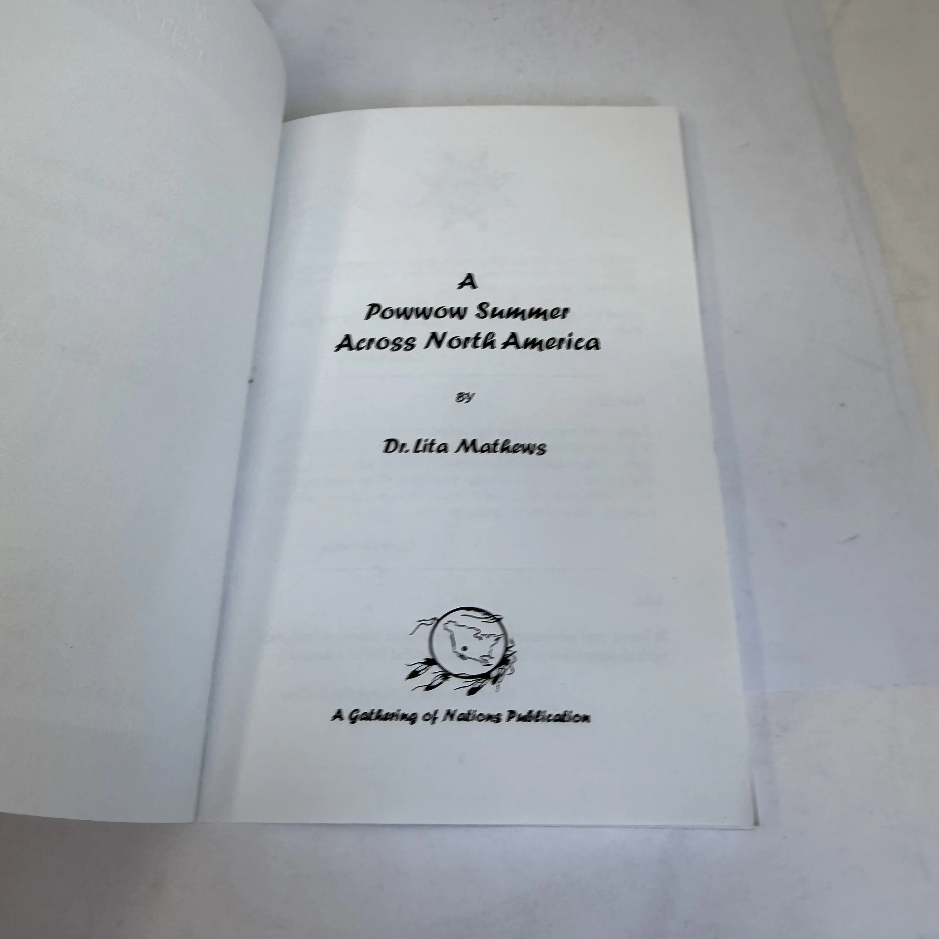 Title page of A Powwow Summer Across North America by Dr. Lita Mathews showing the Gathering of Nations circular logo and imprint line — A Gathering of Nations Publication, Albuquerque New Mexico