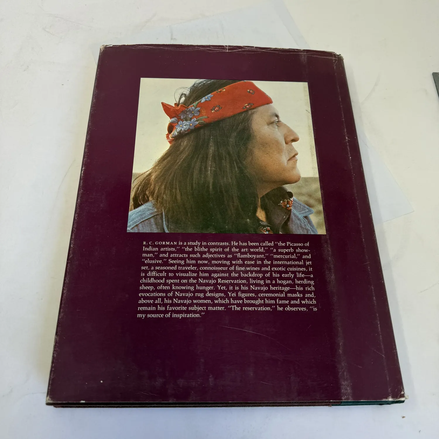 Back cover with dust jacket of R.C. Gorman: The Lithographs — portrait photograph of R.C. Gorman wearing a bandana in profile, with biographical text describing him as the Picasso of Indian artists