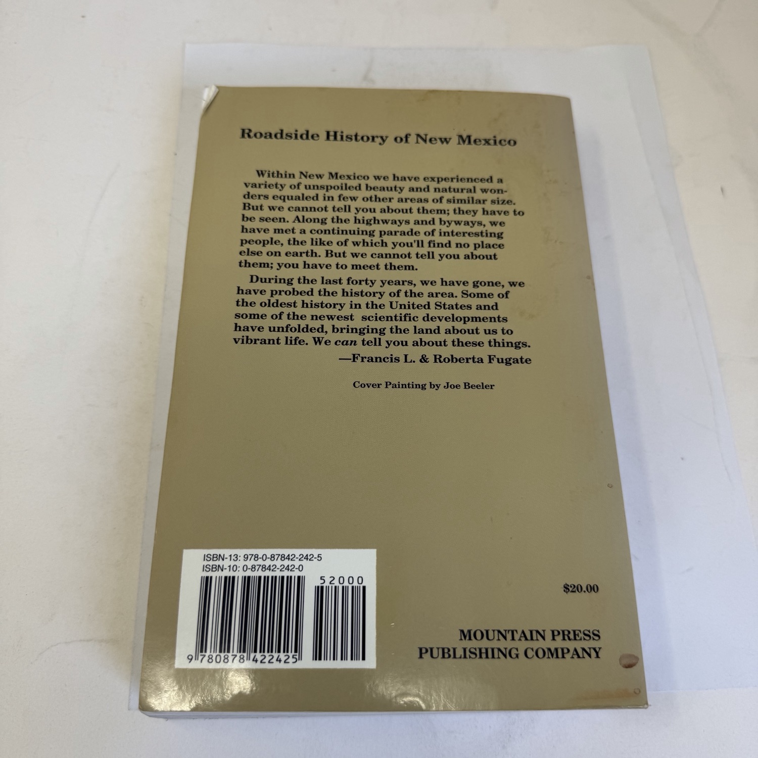 Back cover of Roadside History of New Mexico by the Fugates — author description of New Mexico's beauty and history, cover painting credit to Joe Beeler. ISBN-13 978-0-87842-242-5, ISBN-10 0-87842-242-0. $20.00. Mountain Press Publishing Company, Missoula Montana.