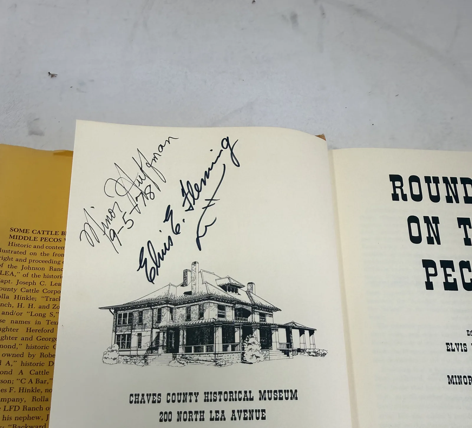Signatures of Elvis E. Fleming and Minor Huffman dated 9-5-81 above a line drawing of the Chaves County Historical Museum on North Lea Avenue in Roswell, photographed at New Mexico Literacy Project
