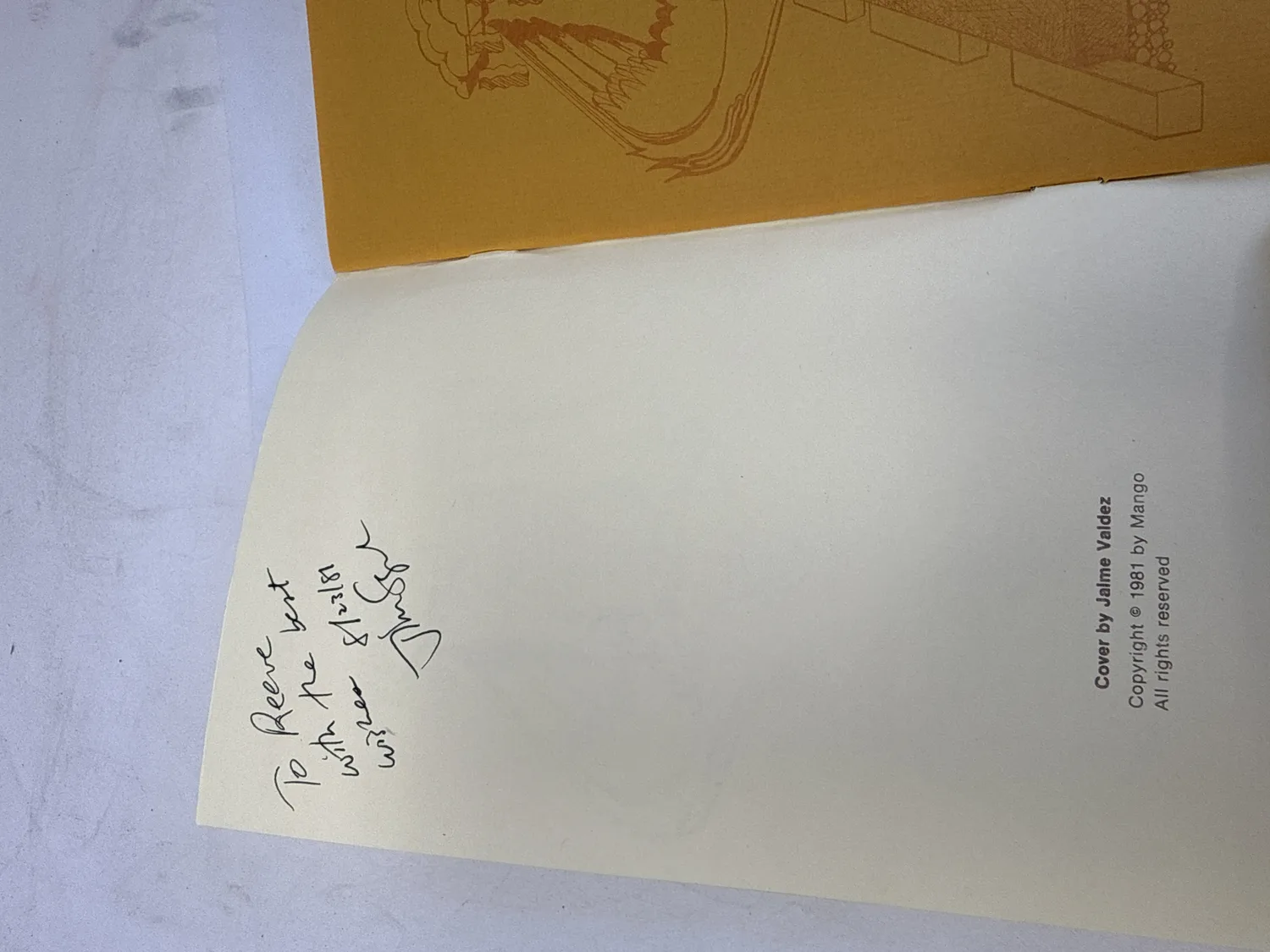 Inside front cover of Foreplay and French Fries showing Jim Sagel's handwritten inscription dated 8/13/81 and copyright page reading Cover by Jaime Valdez, Copyright 1981 by Mango, All rights reserved. Photographed at the New Mexico Literacy Project sorting desk in Albuquerque.