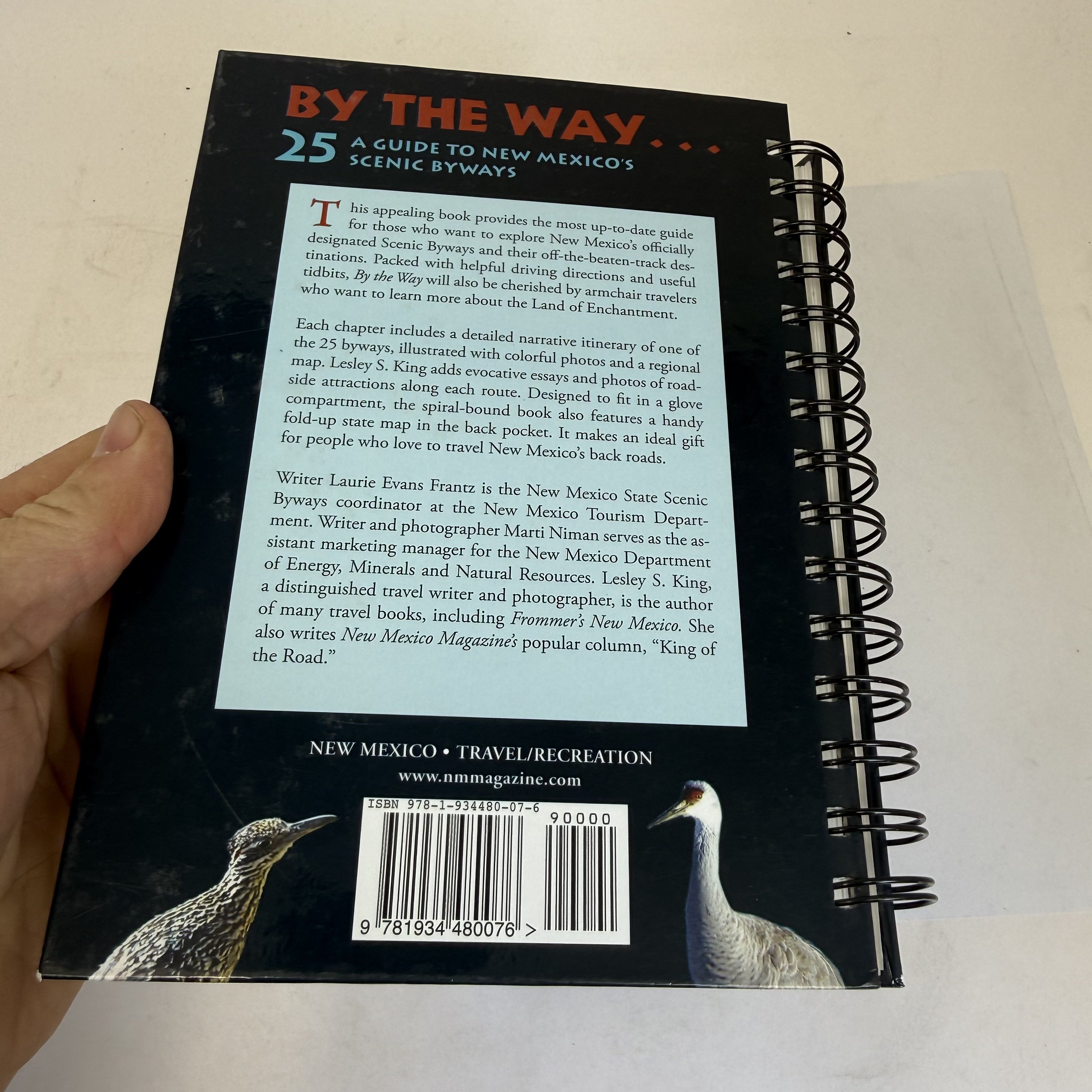 Back cover of By the Way 25 scenic byways guide with book description, author biographies for Laurie Evans Frantz Lesley S. King and Marti Niman, Greater Roadrunner photograph, and NEW MEXICO TRAVEL/RECREATION category label.