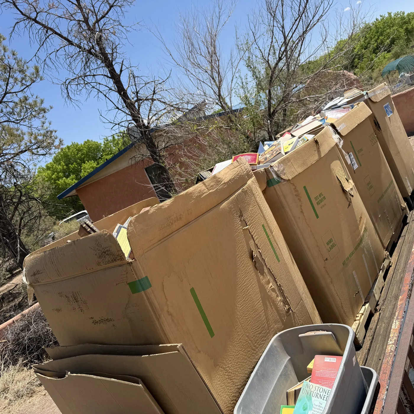 Wall of stacked banker boxes from a Socorro County estate book pickup, May 9 2026