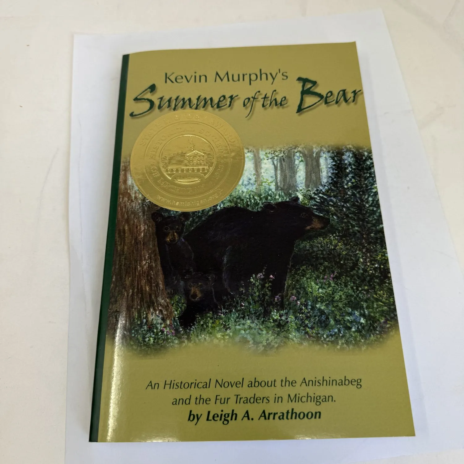 Front cover of Summer of the Bear An Historical Novel about the Anishinabeg and the Fur Traders in Michigan by Leigh A. Arrathoon, Paint Creek Press 2005, with bear illustration and gold award sticker on cover. Found in a New Mexico estate cleanout.