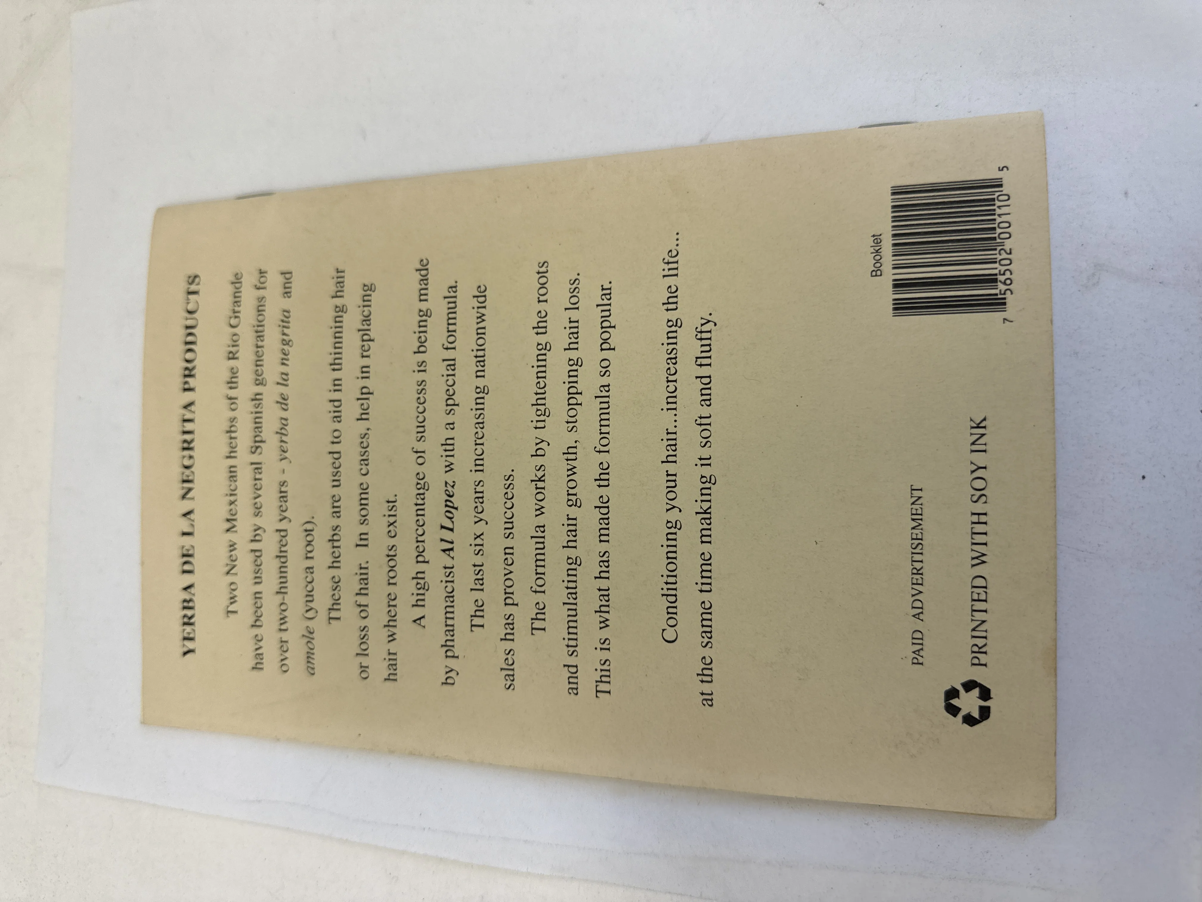 Back cover of Traditional Herbs de Nuevo Mexico — paid advertisement for Yerba de la Negrita Products hair formula by pharmacist Al Lopez using yerba de la negrita and amole yucca root, barcode 7 56502 00110 5, printed with soy ink recycling symbol