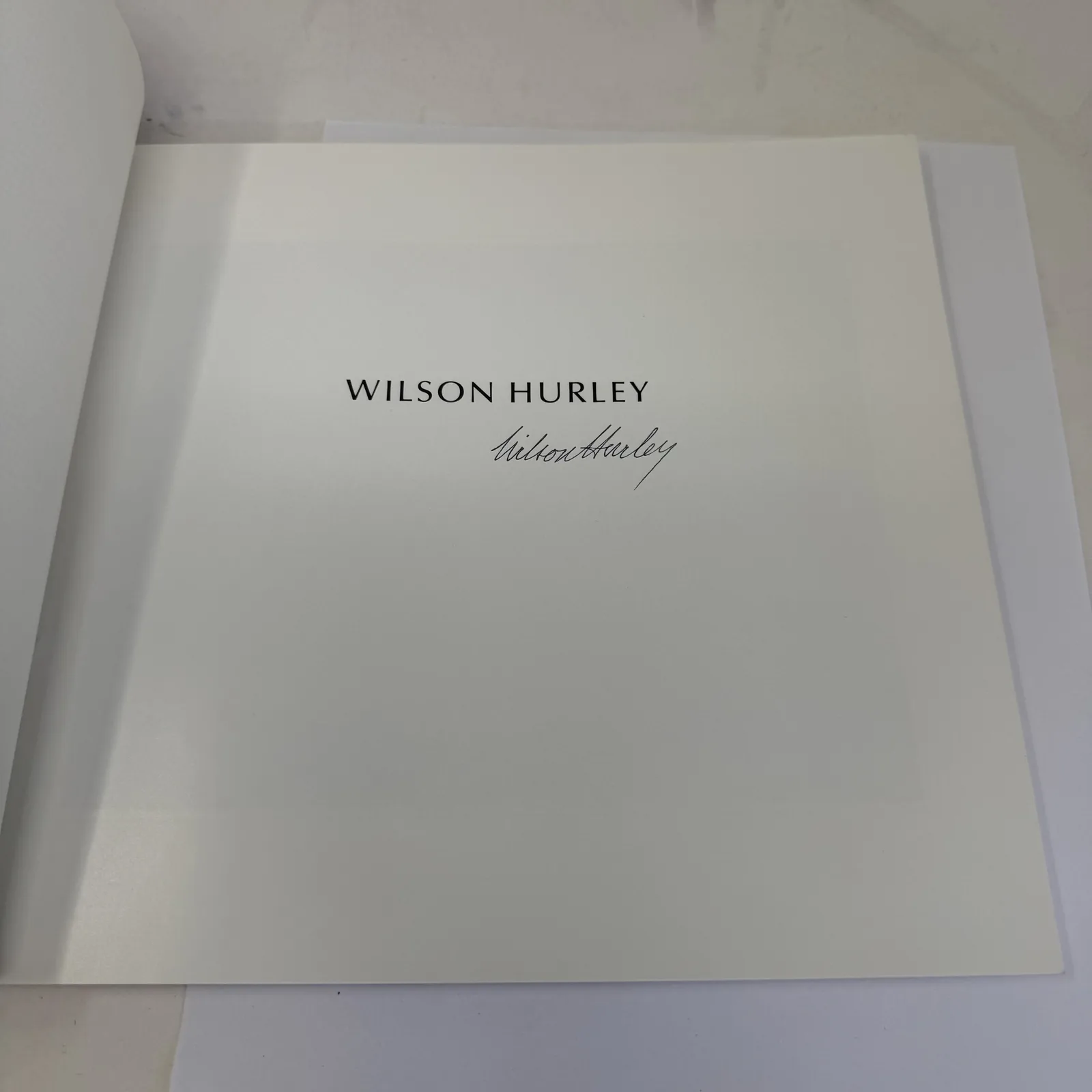 Wilson Hurley ink signature on the half-title of An Exhibition of Oil Paintings, Lowell Press trade issue in wrappers, photographed at New Mexico Literacy Project