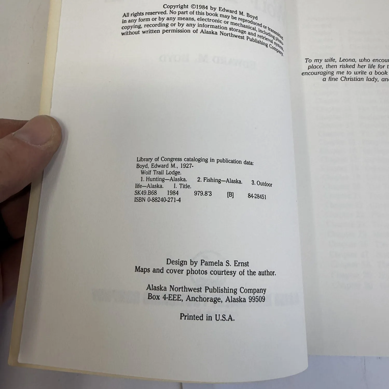 Copyright page of Wolf Trail Lodge by Edward M. Boyd showing Copyright 1984, Library of Congress cataloging data Boyd Edward M. 1927 with subjects Hunting Alaska Fishing Alaska Outdoor life Alaska, SK49.B68 1984, ISBN 0-88240-271-4, LC 84-28451, Design by Pamela S. Ernst, Maps and cover photos courtesy of the author, Alaska Northwest Publishing Company Box 4-EEE Anchorage Alaska 99509, Printed in U.S.A. Dedication to wife Leona visible on facing page.